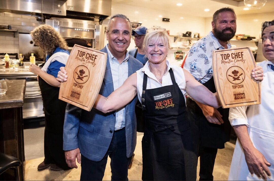 Nannette Walsh holding Top Chef and Top Dish awards at Martin County Top Chef 2026
