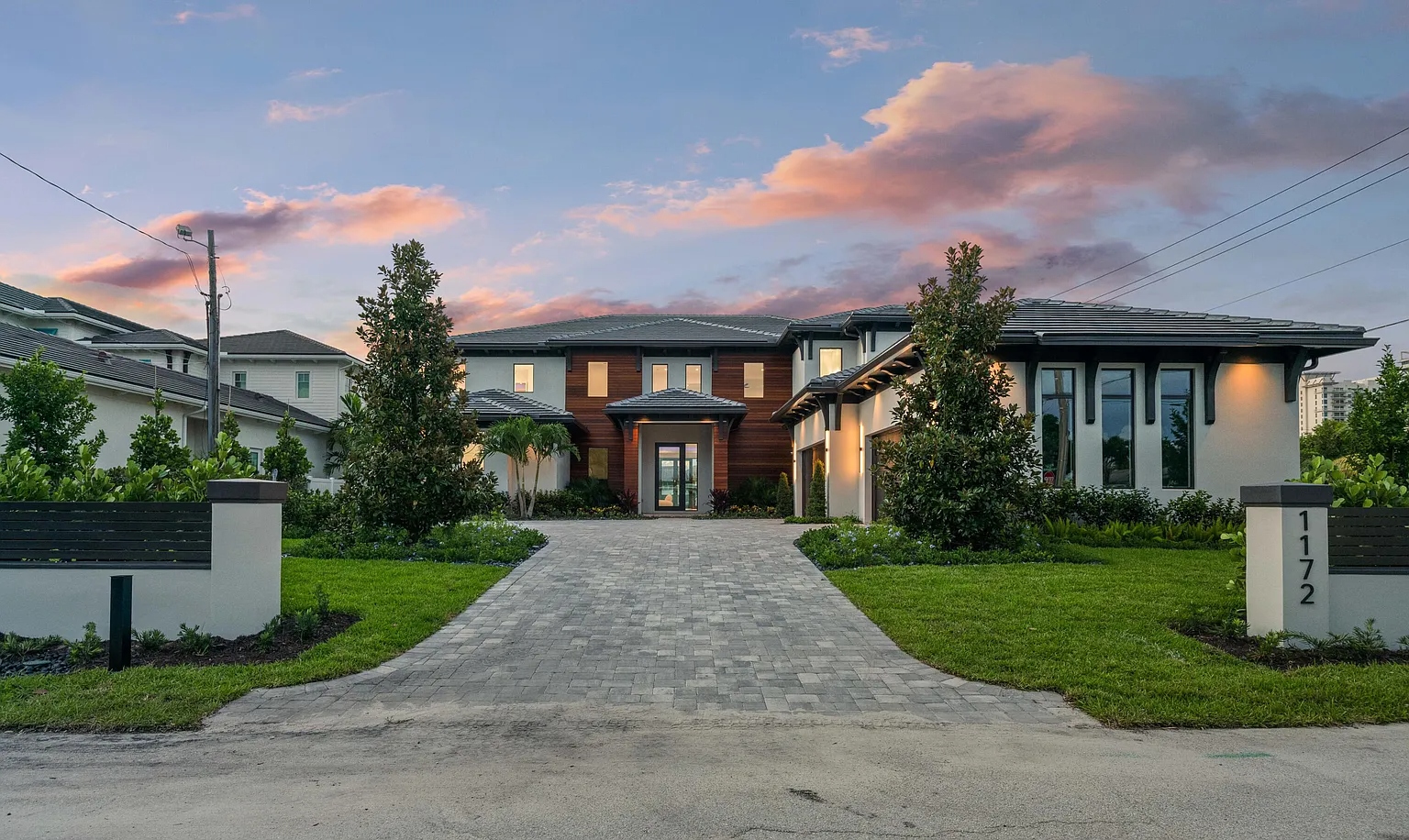 1172 S Harbor — luxury custom home at twilight with ES Prestige impact windows