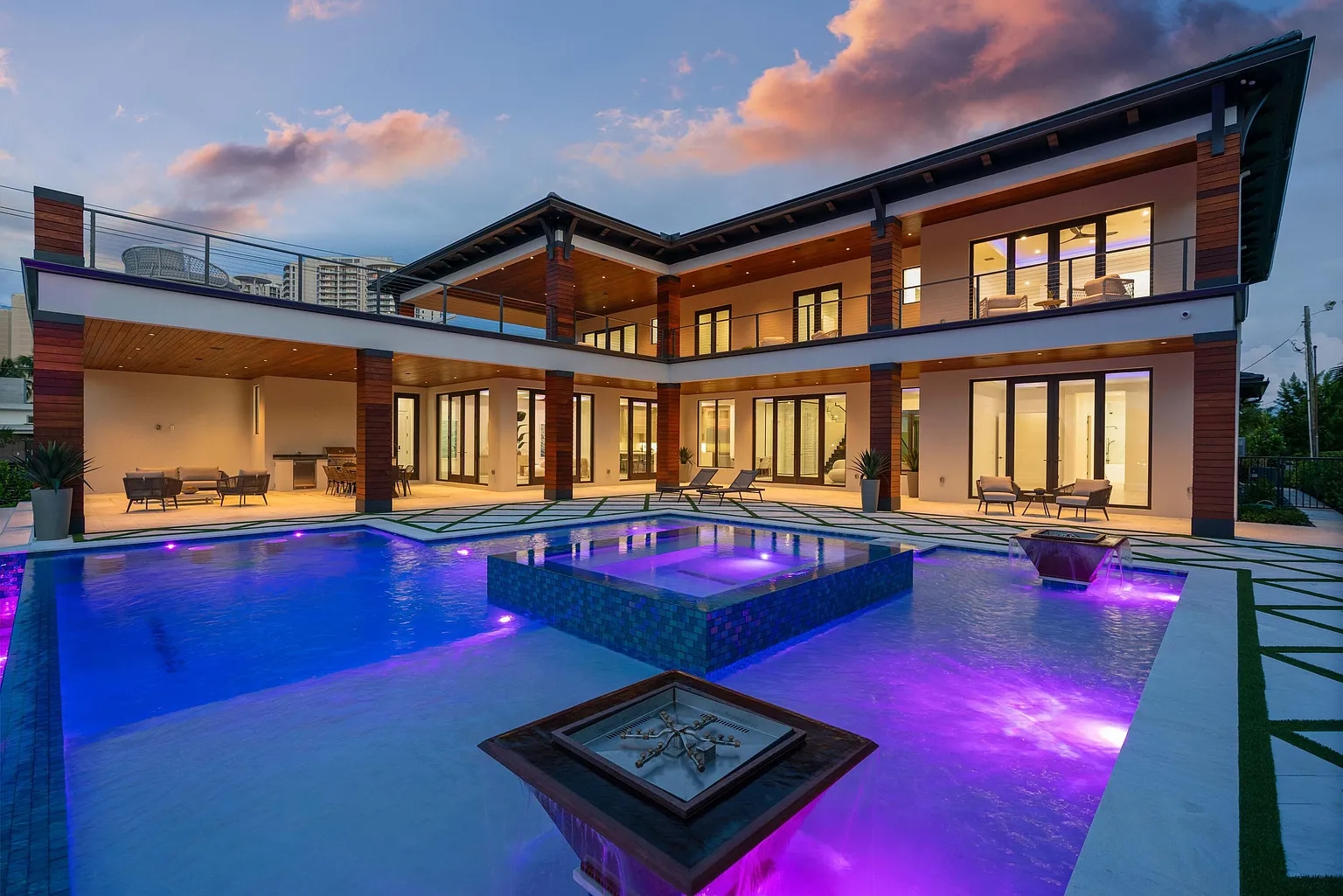 1172 S Harbor pool at twilight — ES Prestige sliding doors lit from within