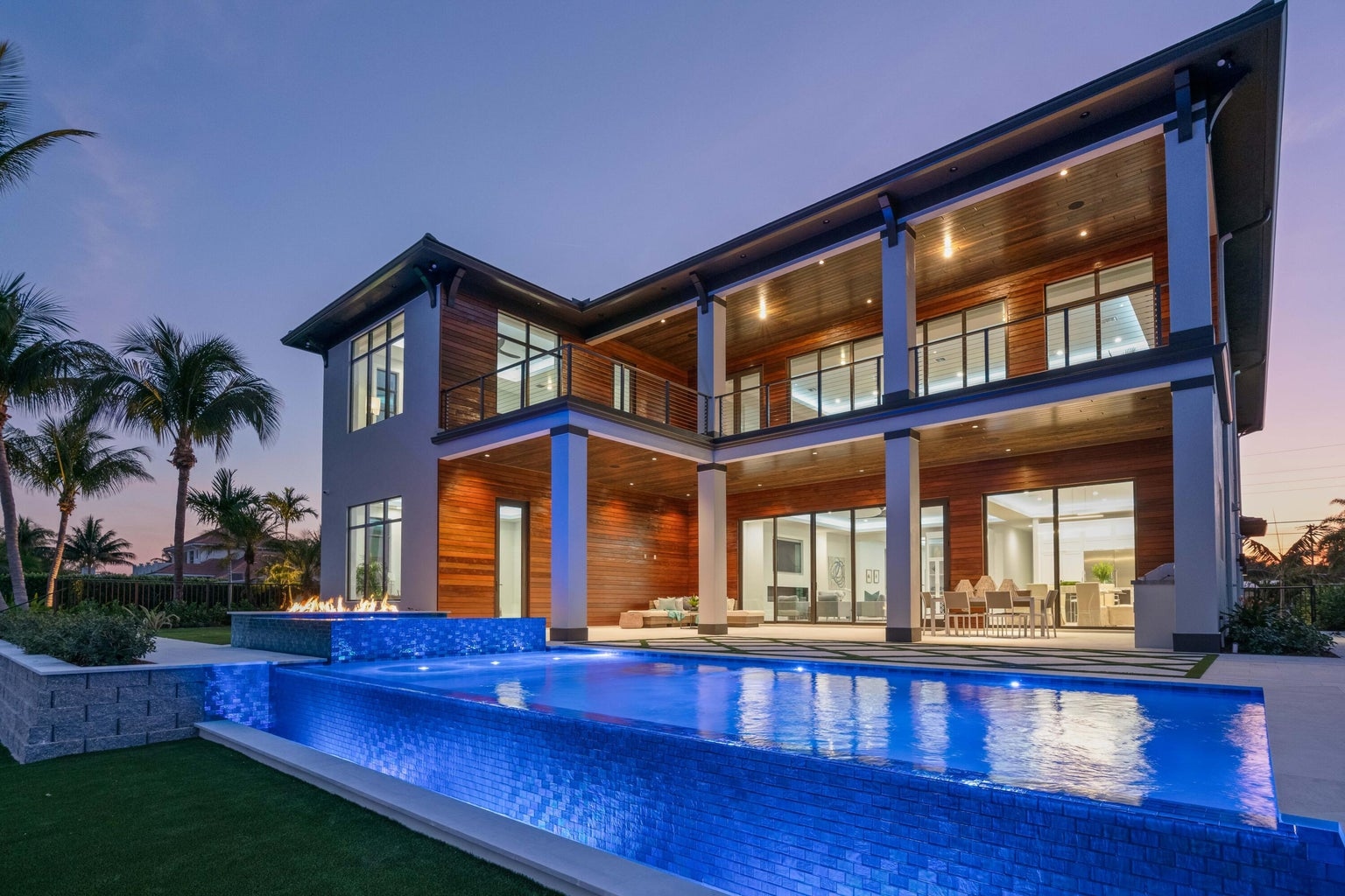736 Lagoon Drive West Palm Beach — luxury waterfront home at twilight