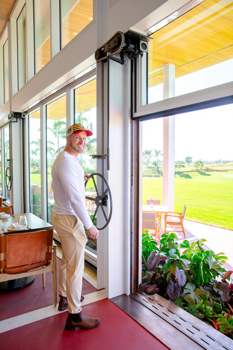 Atlantic Fields Golf House - window wall panel raised at the hand-crank lift mechanism