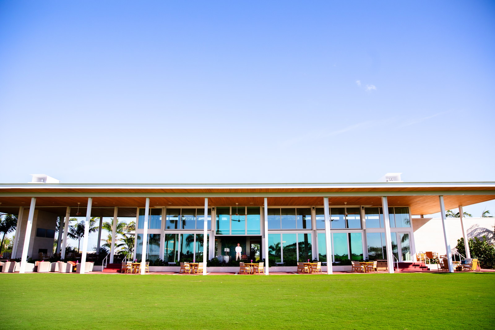 Atlantic Fields Golf House - the full glazed elevation seen across the lawn