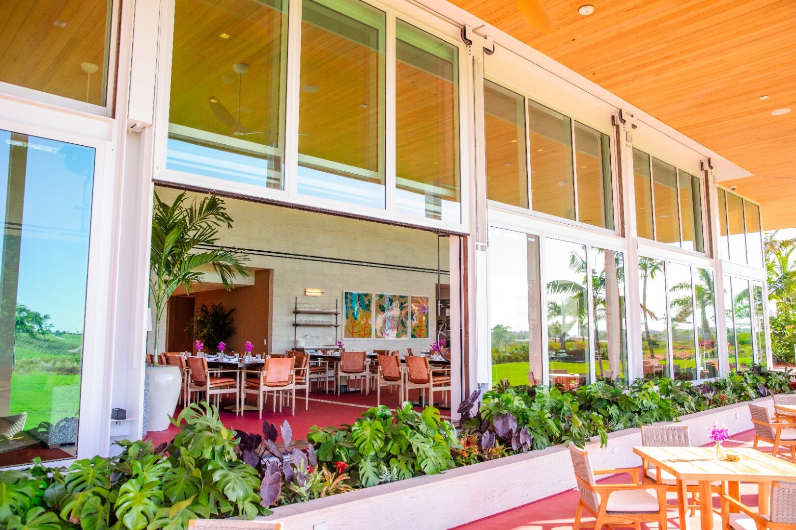 ACG commercial glazing — Atlantic Fields Golf House window wall open to the fairway