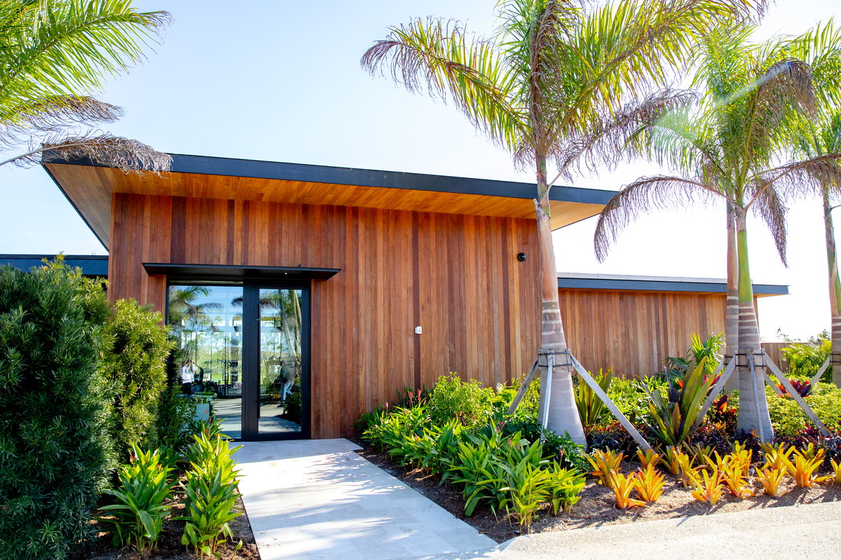 Atlantic Fields Performance Center - glazed entry door set into the cedar wall