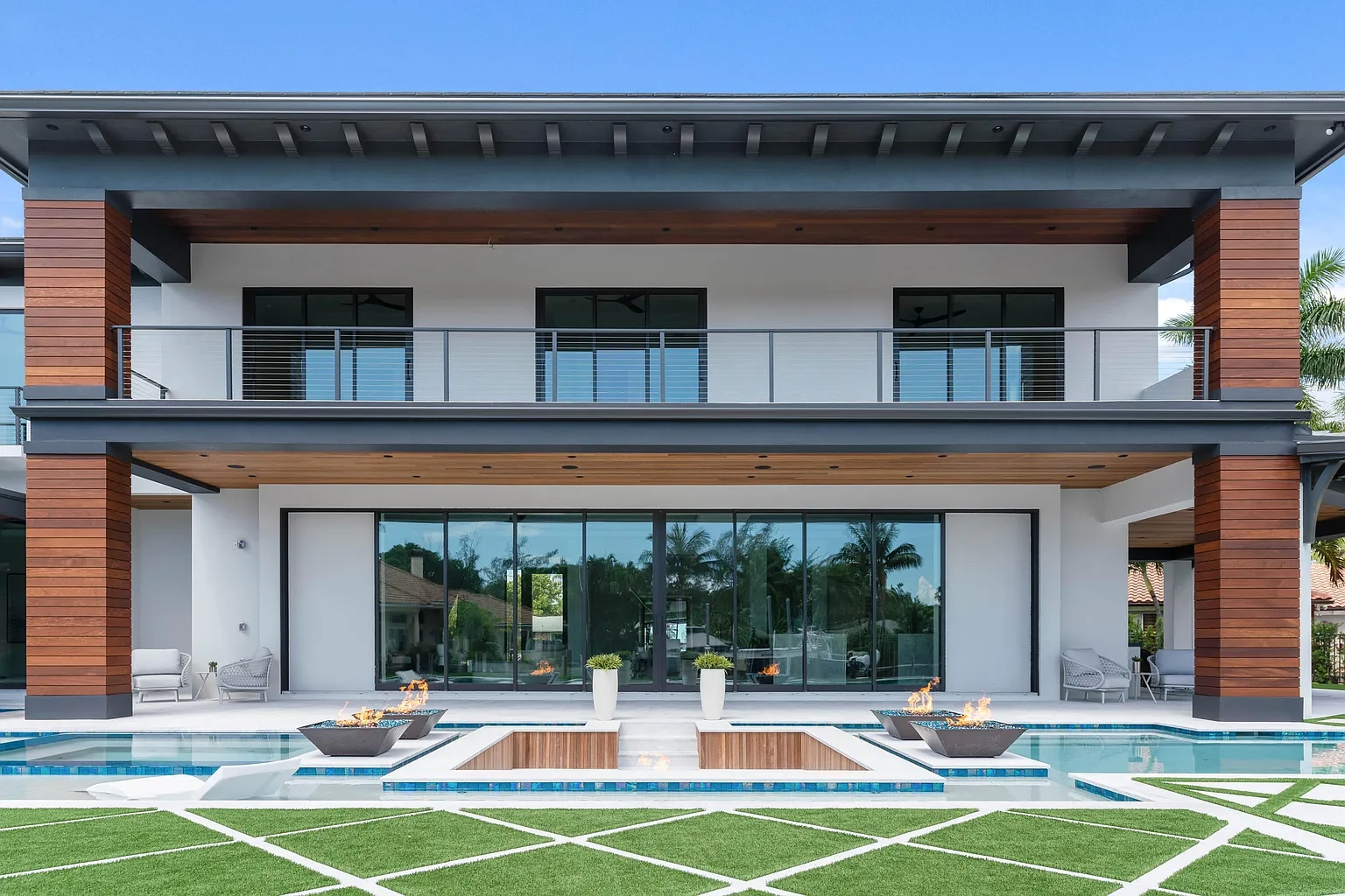 Rear elevation with multi-slide impact doors and pool