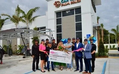El Car Wash Northlake grand opening ribbon cutting in front of the completed building