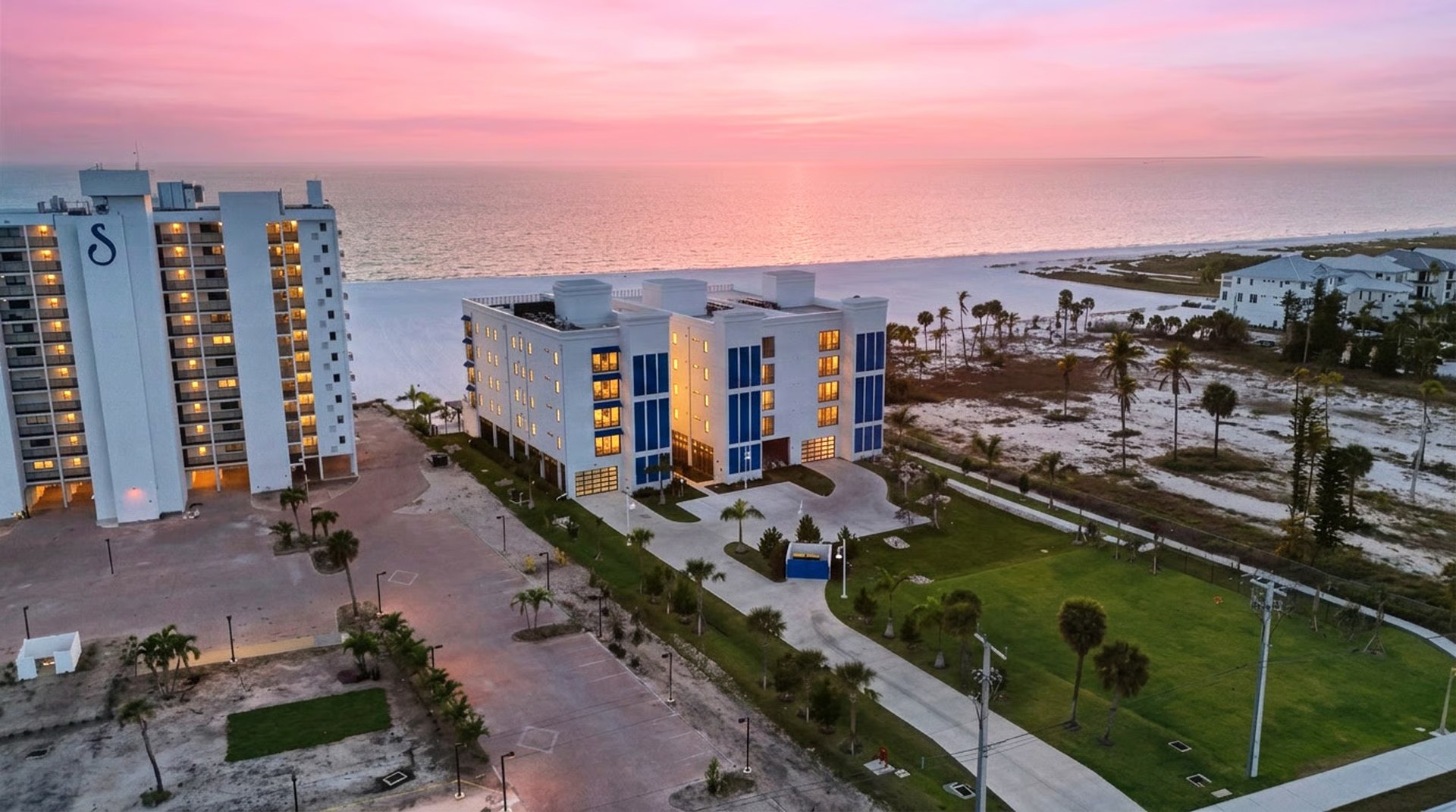 Gulfside Twelve aerial at sunset — Gulf-facing facade