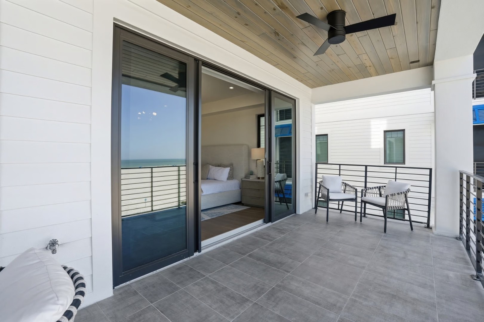 Bedroom balcony with wood-plank ceiling and Gulf view