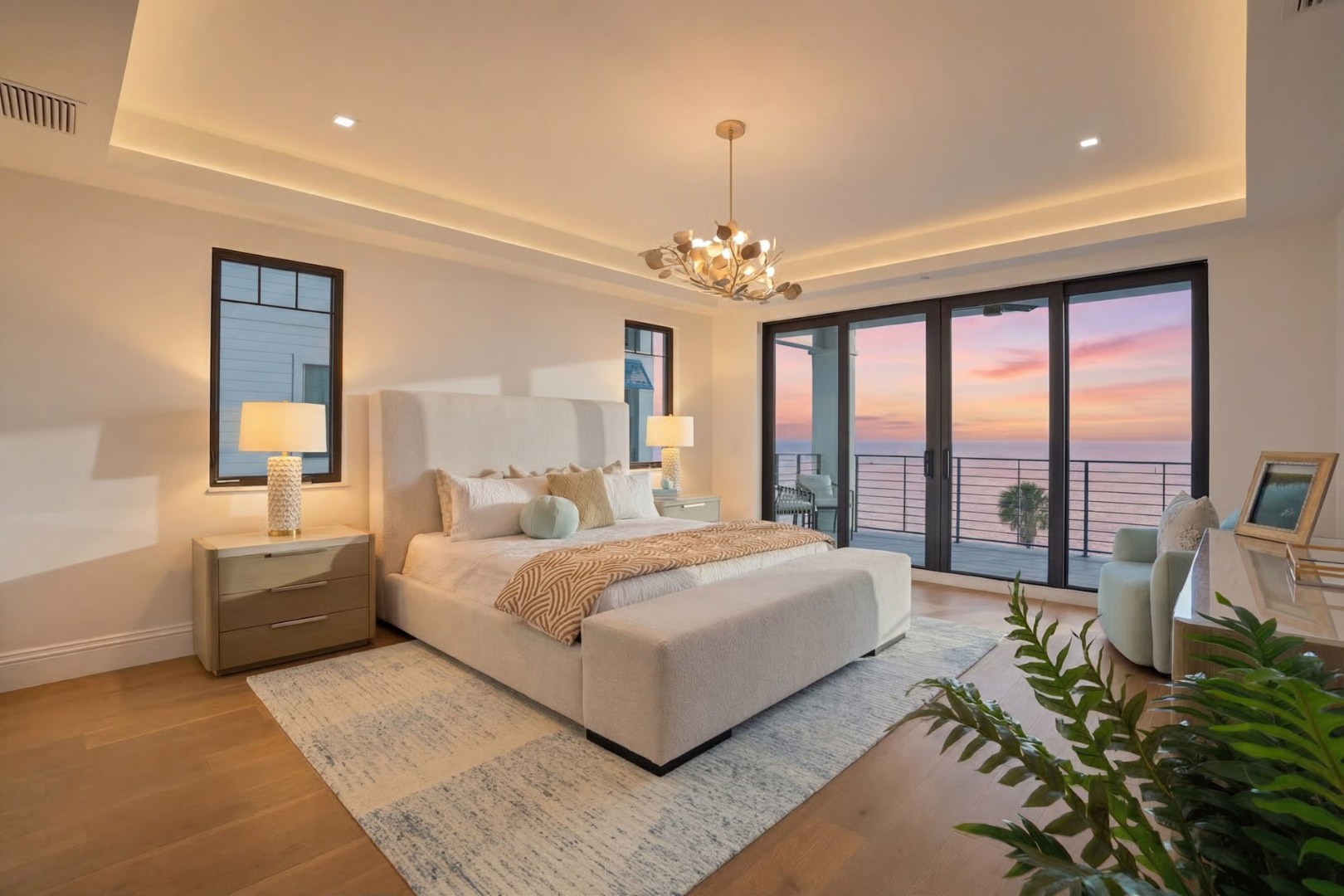 Primary bedroom at sunset with Gulf-front impact sliders