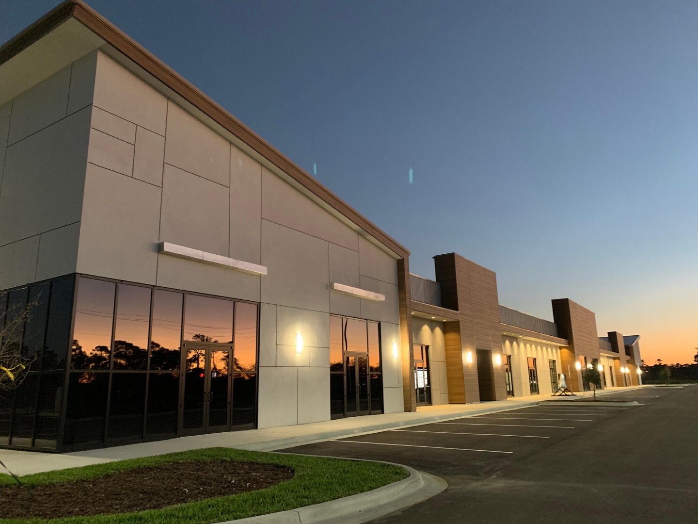 Hardy World 4.0 Melbourne FL — commercial storefront glazing at twilight