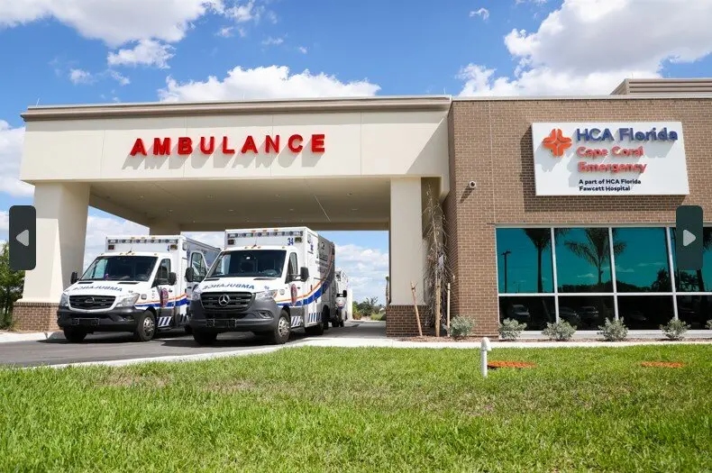 HCA Cape Coral ambulance bay — PGT storefront glazing by day