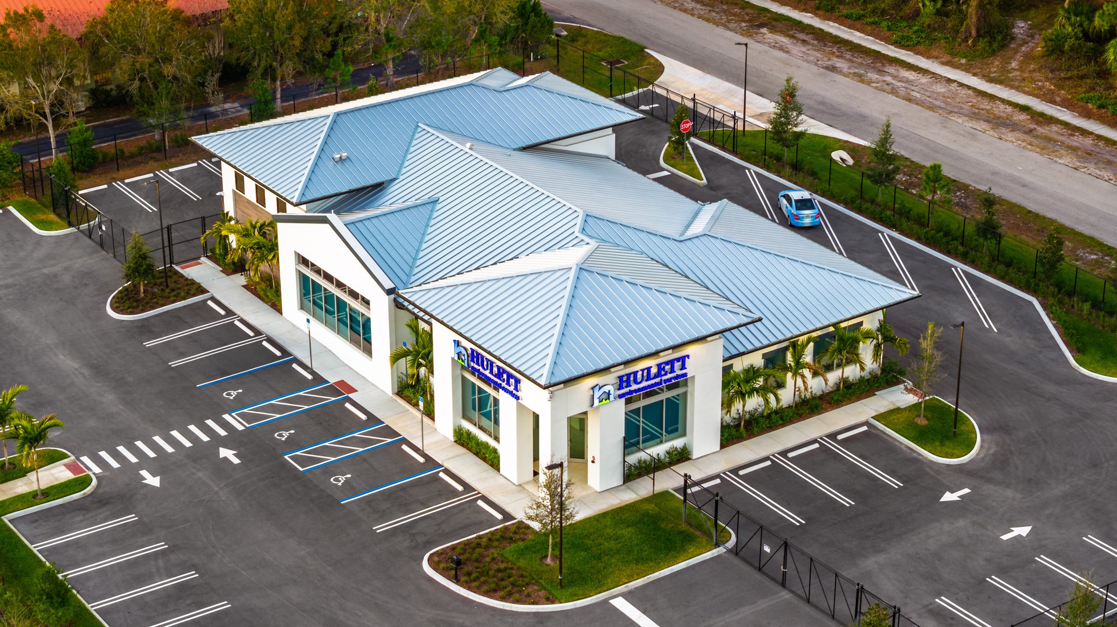 Hulett Environmental — Port St. Lucie headquarters at sunset, ESWindows commercial glazing