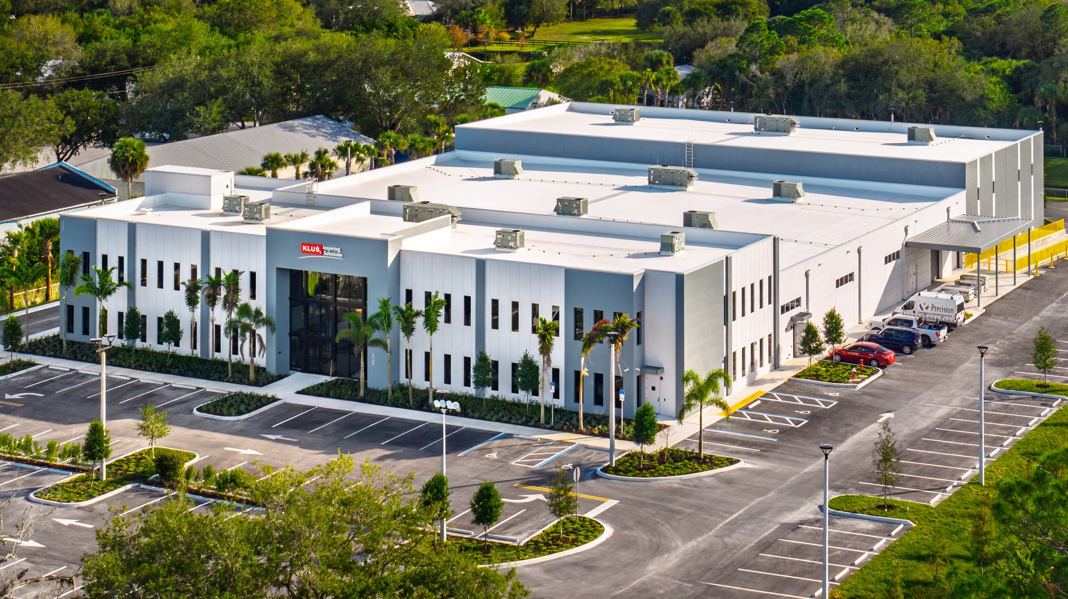 KLUS Lighting Vero Beach — completed showroom with ESWindows storefront, aerial view