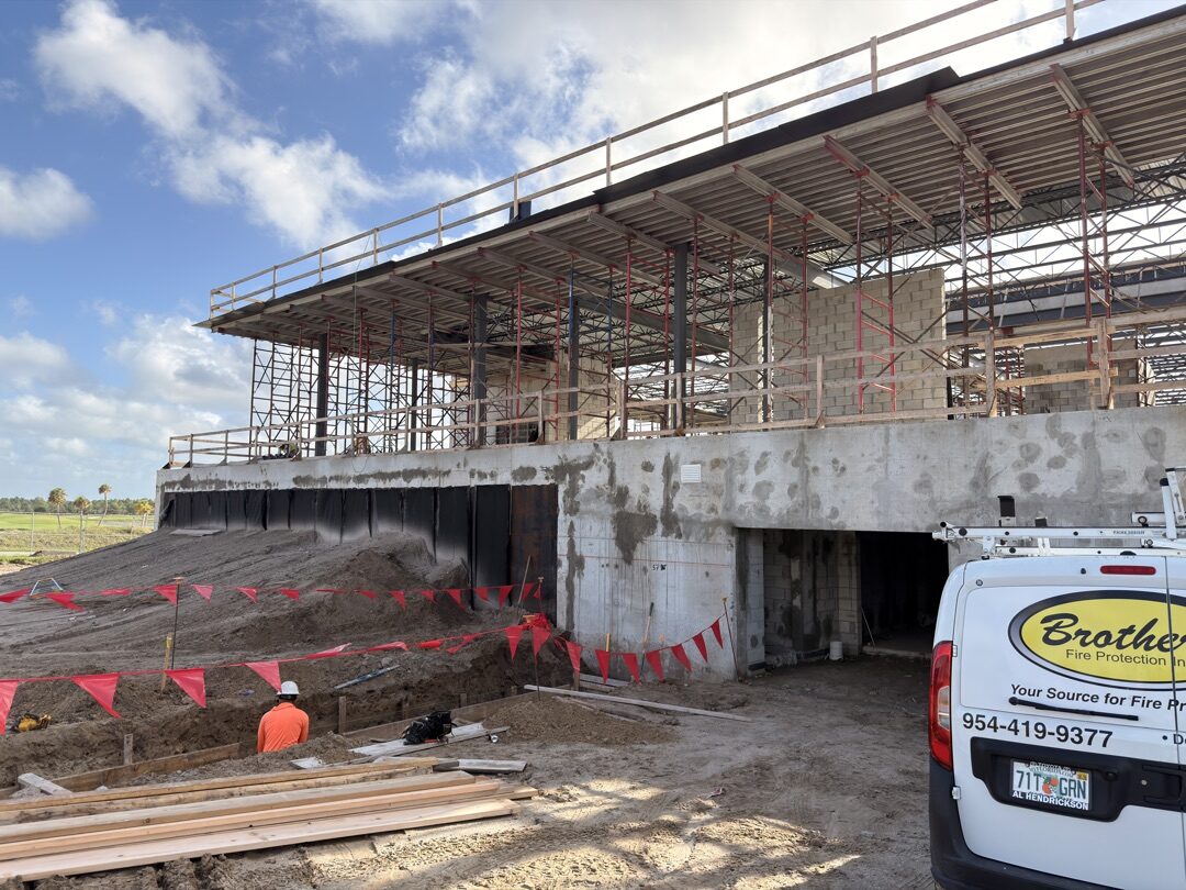 Panther National Clubhouse exterior — two-story structure with scaffolding