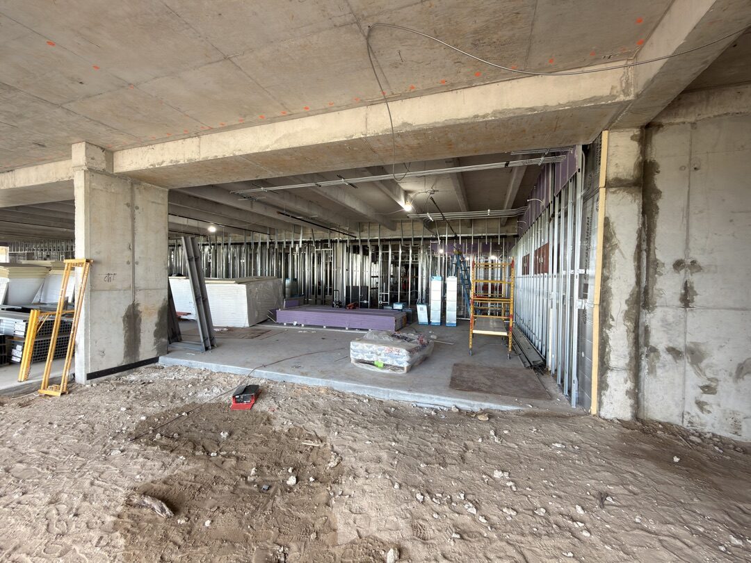 Panther National Clubhouse interior — glass panels staged for installation