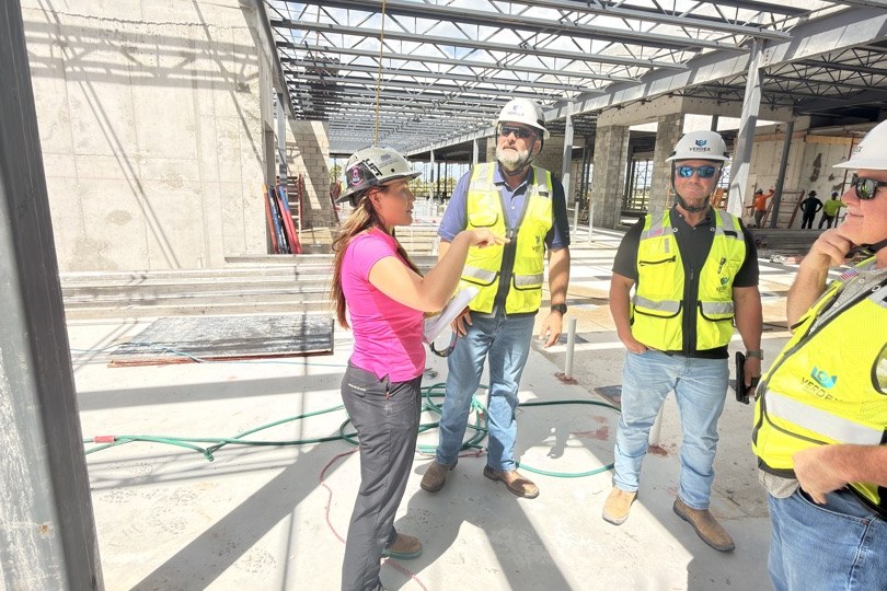 Rielly Walsh, CEO of American Commercial Glass, on site at the Panther National clubhouse with the Verdex Construction team during a structural walkthrough