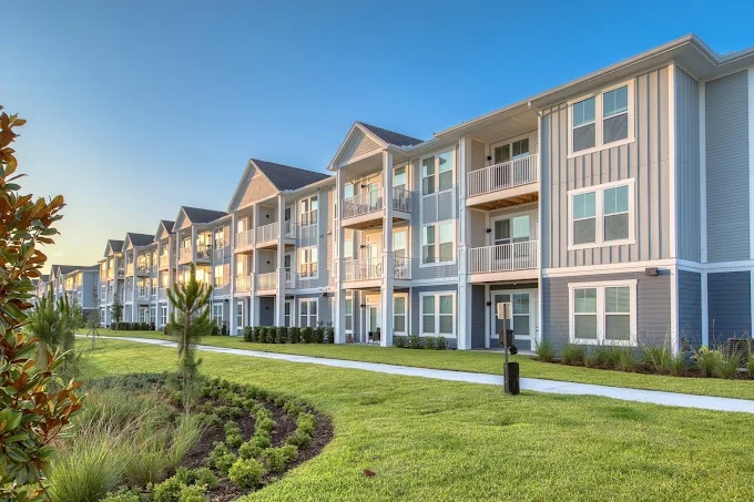 The Pointe at Palm Bay residential building elevation at golden hour