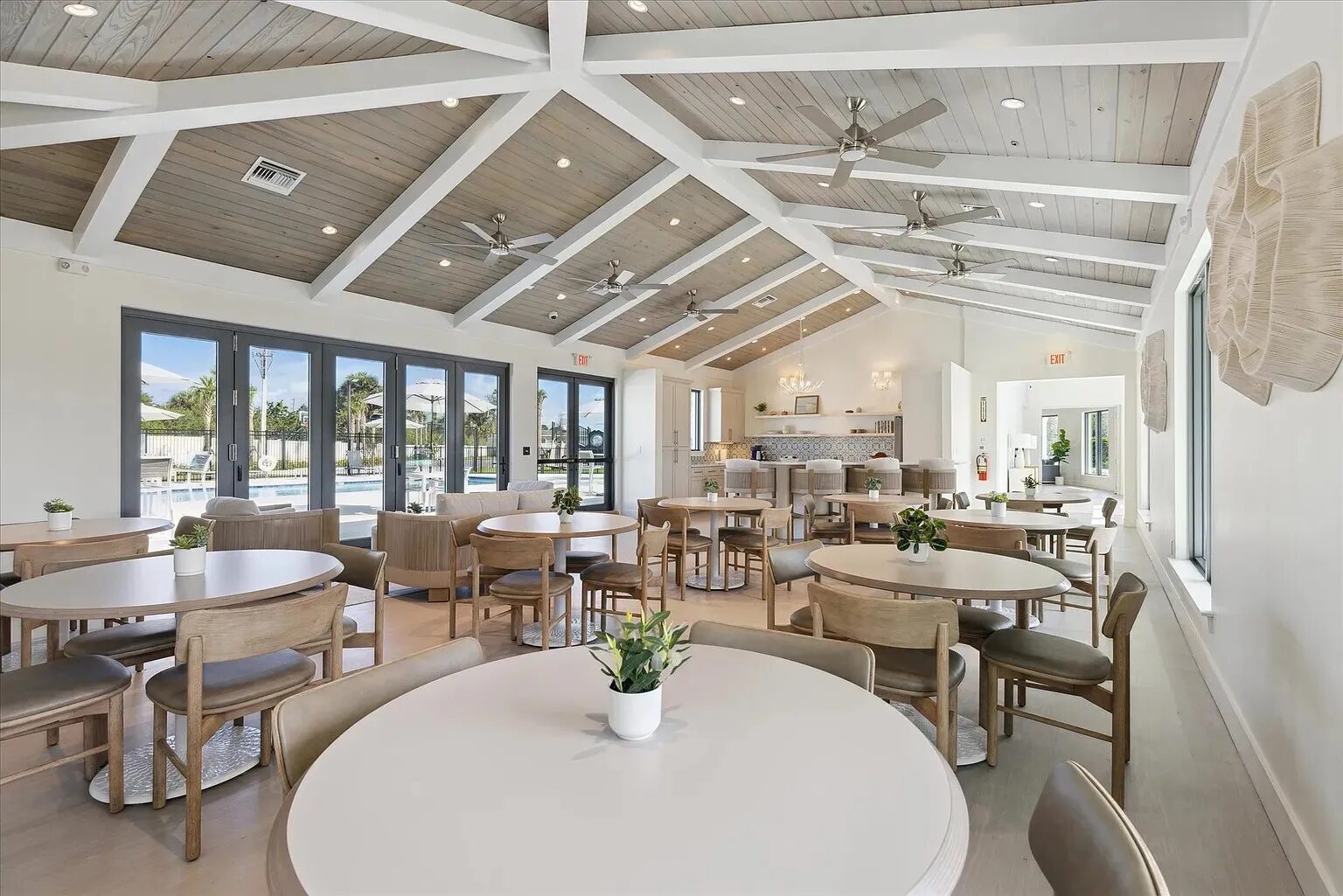 Savannas Ridge Clubhouse dining room — ESWindows sliding doors open to pool