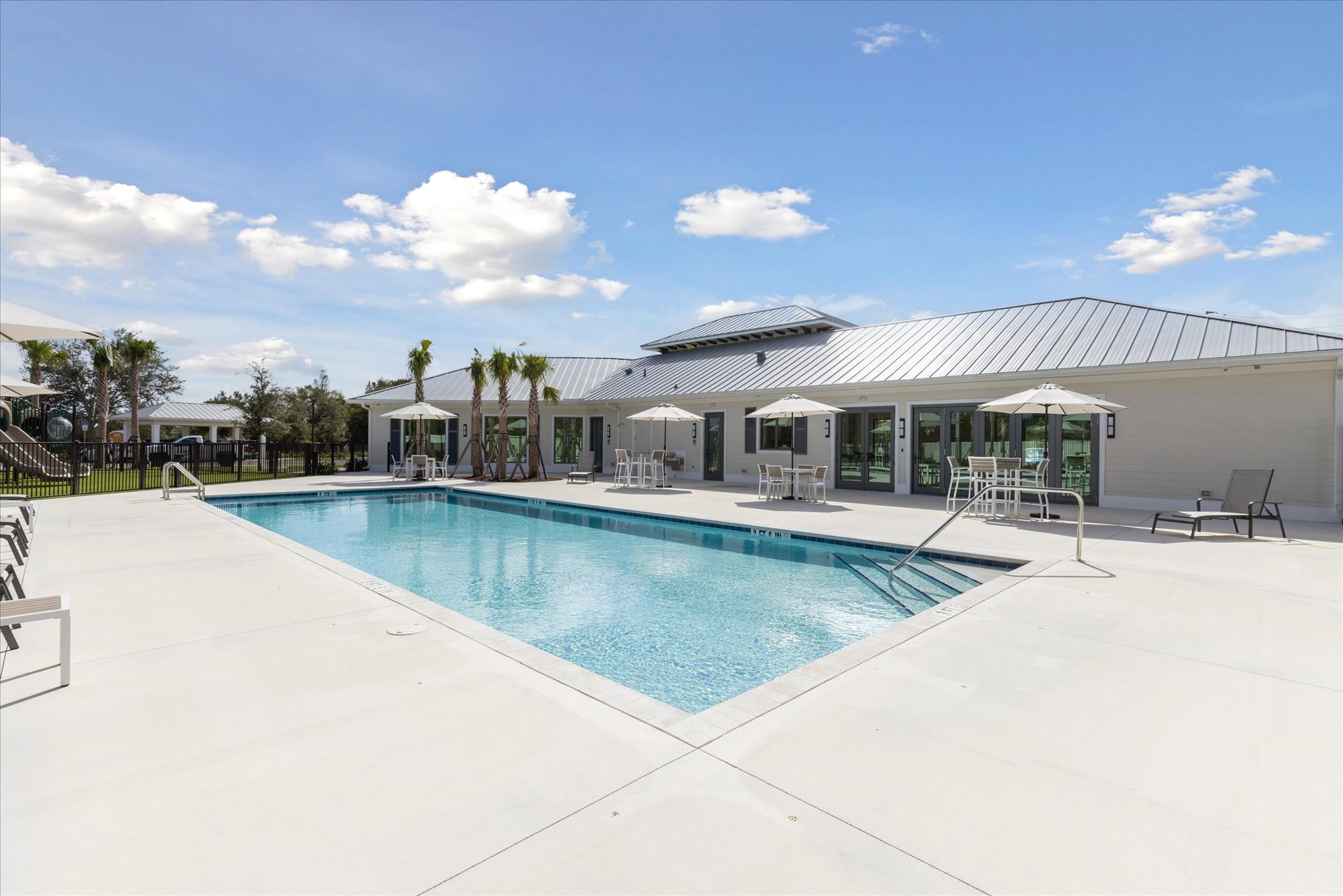 Savannas Ridge Clubhouse pool elevation - sliding glass doors by American Commercial Glass, Fort Pierce