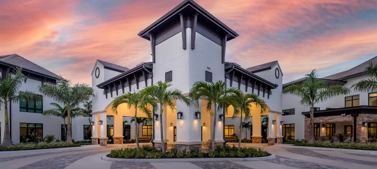 Siena Lakes by Erickson Senior Living Naples Florida — exterior at sunset
