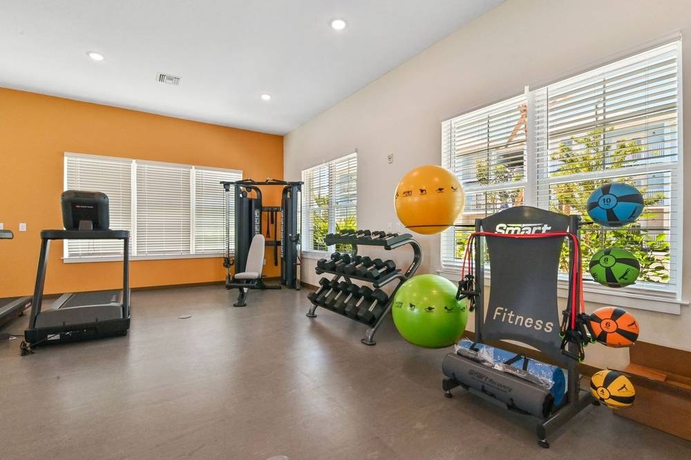 Amenity fitness center with daylight storefront