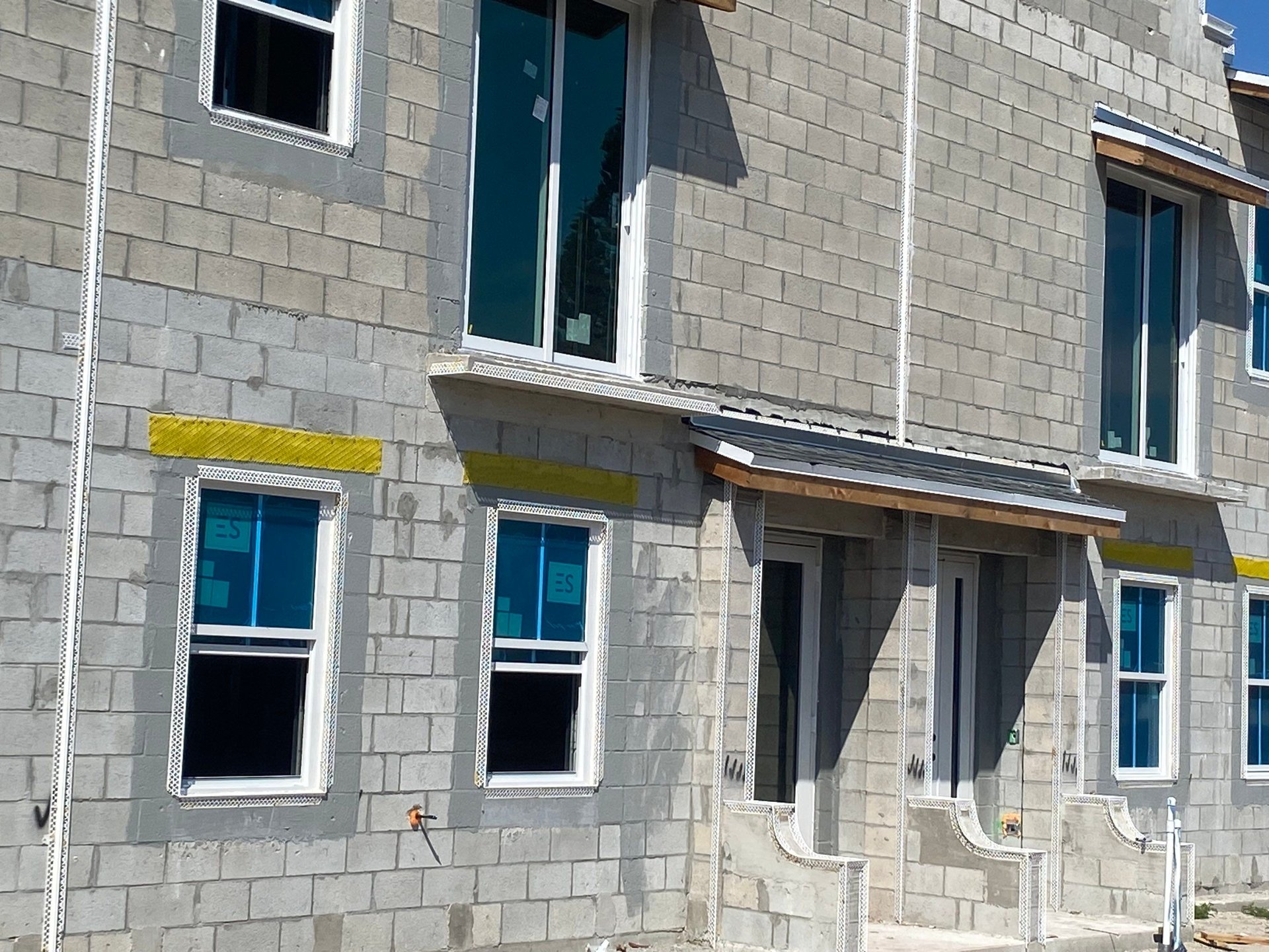 ES-SGD2020 impact-rated sliding glass door context &mdash; Villa L Onz townhomes, Riviera Beach