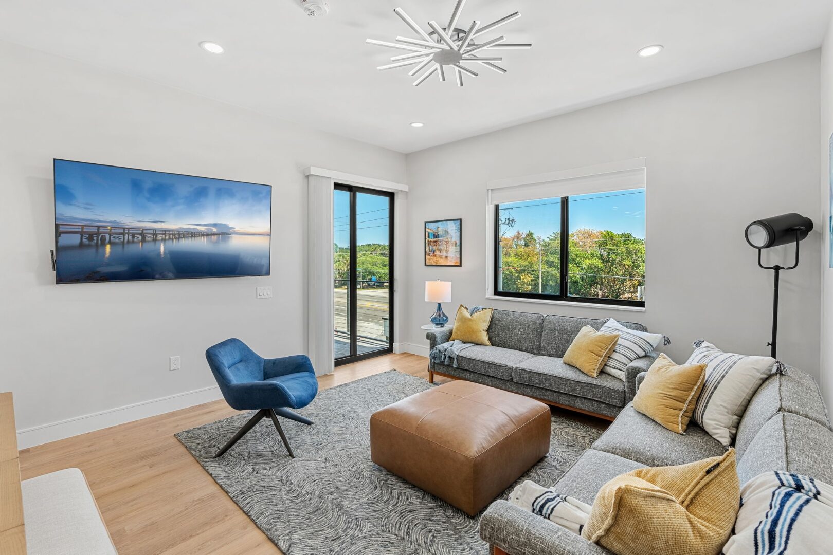 Wave Haven interior — ESWindows black-framed sliding door and window with balcony view