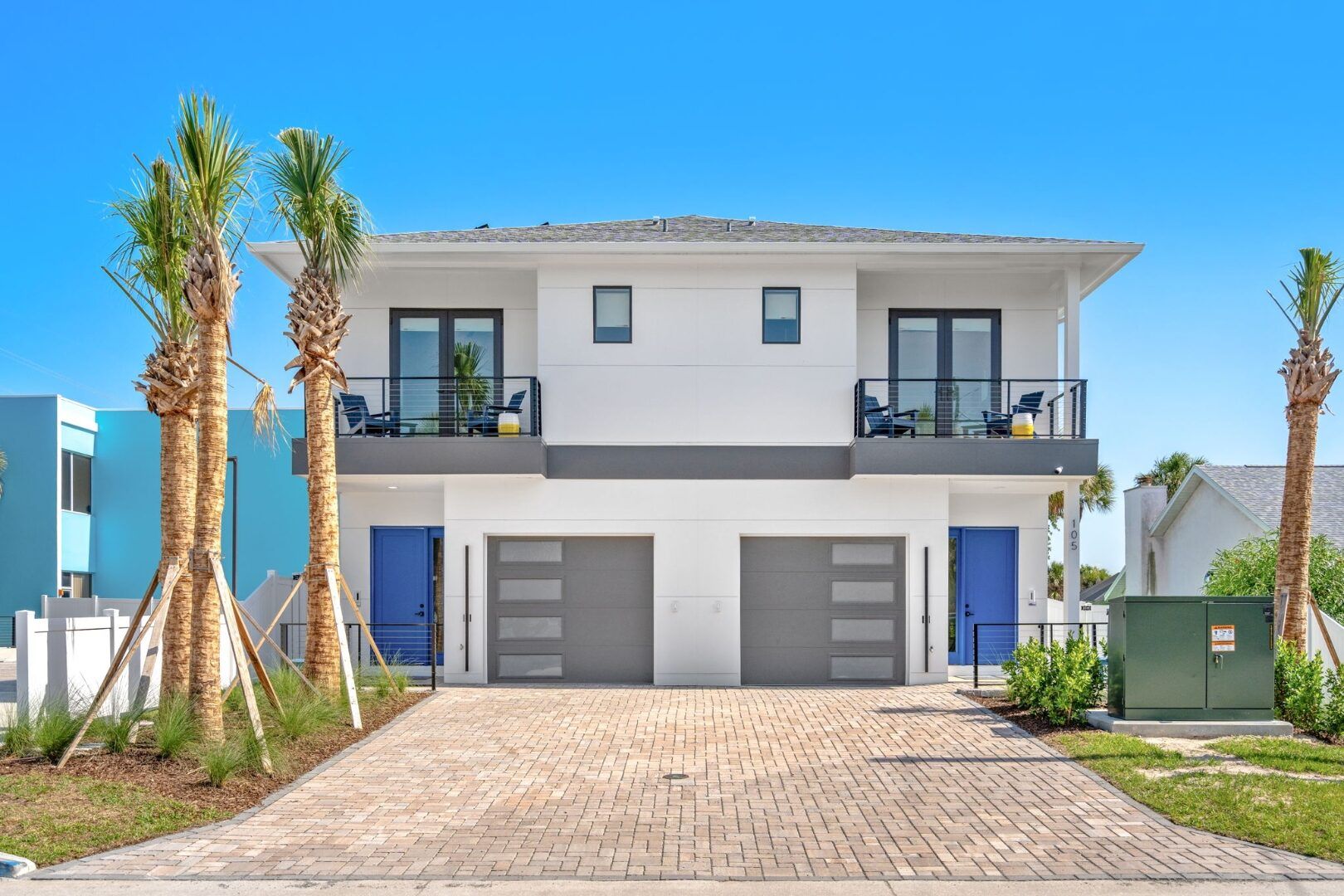 Wave Haven Cocoa Beach residential townhomes — ESWindows dark-framed impact windows