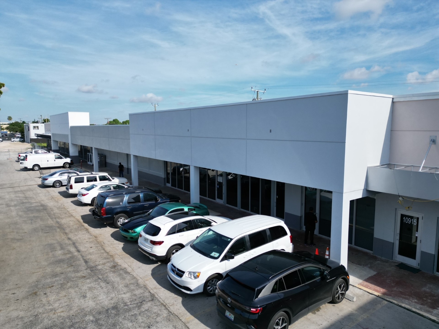 Westlake Shopping Center — completed facade with tenant units 10915 and 10917 showing new storefront glazing