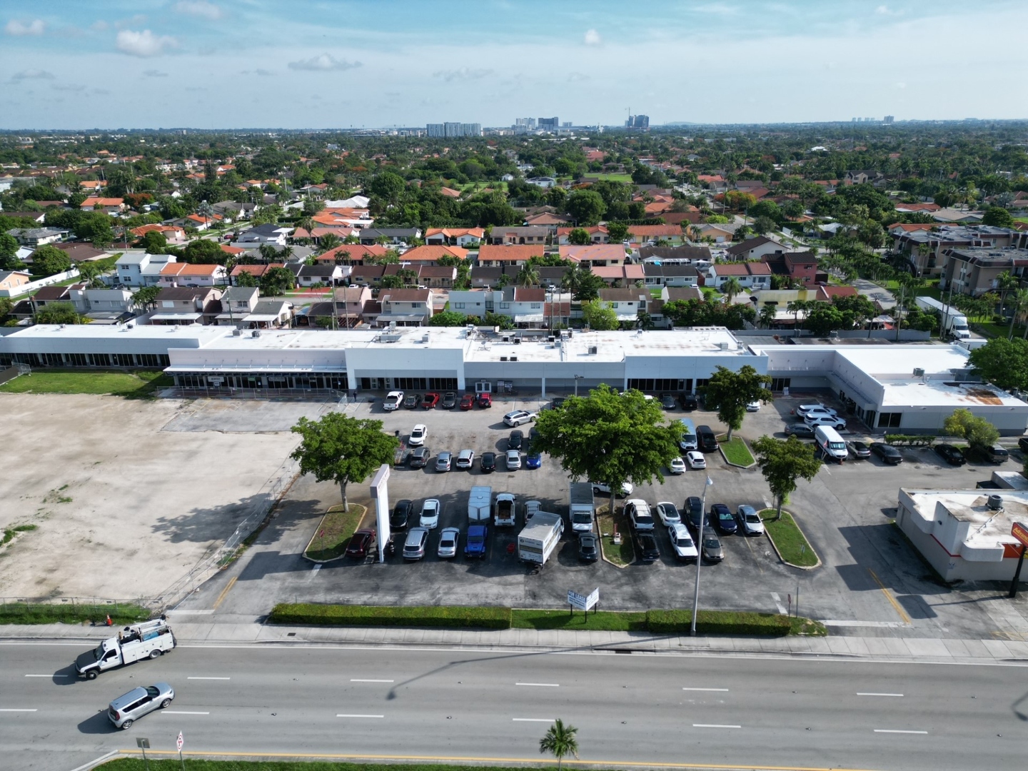 Westlake Shopping Center Hialeah FL — aerial view of completed center with Miami skyline in background