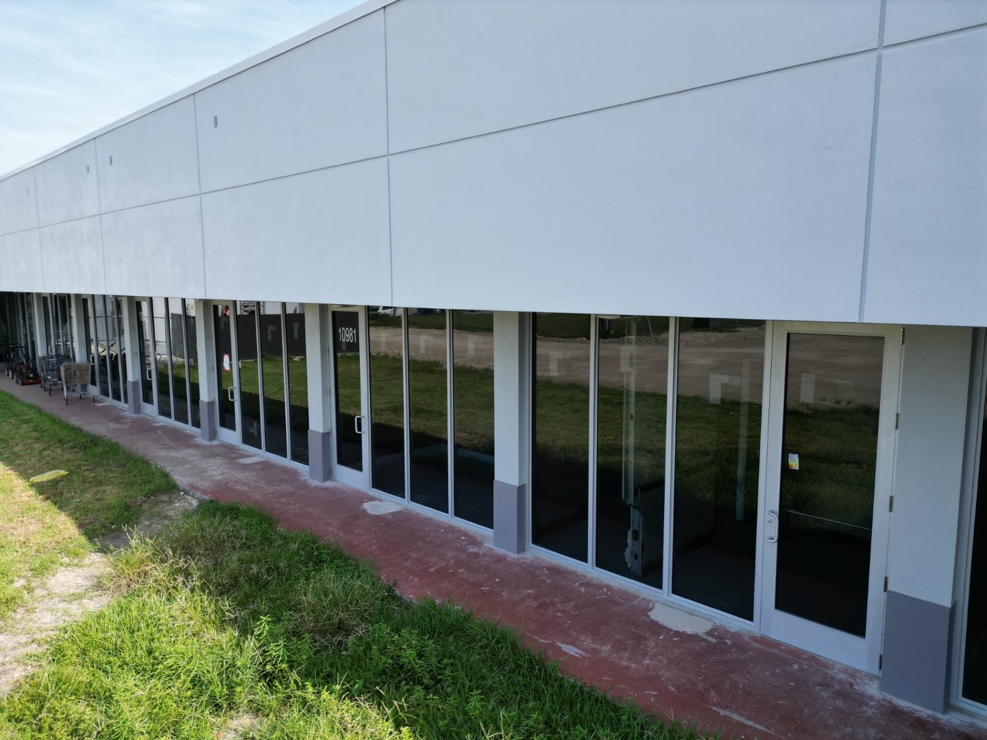 Westlake Shopping Center — new ESWindows commercial storefront spanning full facade width, completed installation